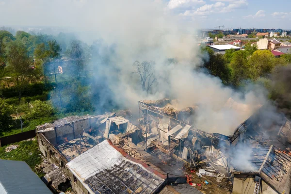 aerial-view-of-ruined-building-on-fire-with-collap-2026-01-06-09-26-38-utc