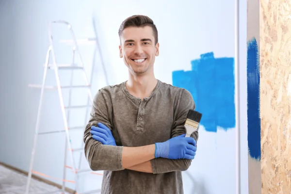 portrait-of-male-decorator-with-brush-indoors-2026-01-15-21-31-19-utc